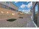 Low-maintenance backyard with rock landscaping, artificial turf, and a patio at 8043 Tank Loop St, Las Vegas, NV 89166