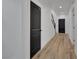 Hallway features modern doors, wood flooring and neutral walls at 8043 Tank Loop St, Las Vegas, NV 89166