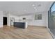 Open concept kitchen and living space filled with natural light and modern appliances at 8043 Tank Loop St, Las Vegas, NV 89166