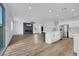 Spacious living space with a fireplace and an island bar separating kitchen and living area at 8043 Tank Loop St, Las Vegas, NV 89166