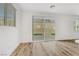 Modern living space features a sliding glass door and wood look flooring at 8043 Tank Loop St, Las Vegas, NV 89166