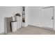 Utility room with a water heater, water softener, and access door to the garage at 8043 Tank Loop St, Las Vegas, NV 89166