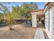 View of the large backyard featuring a covered patio area perfect for entertaining, next to a paved patio at 8217 Ashkum Ave, Las Vegas, NV 89149