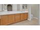 Bathroom with double sink vanity, tile flooring, and bright natural light at 8217 Ashkum Ave, Las Vegas, NV 89149