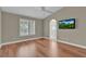 Bedroom with vaulted ceilings, hardwood floors, ceiling fan, and en suite bathroom at 8217 Ashkum Ave, Las Vegas, NV 89149