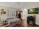 Bright bedroom featuring hardwood floors, neutral walls, and a door to the bathroom at 8217 Ashkum Ave, Las Vegas, NV 89149