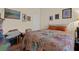 Bedroom with bright bedspread, hardwood floors, and simple decor at 8217 Ashkum Ave, Las Vegas, NV 89149