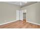 Neutral bedroom with wood laminate flooring, open doors to closet, and ample space at 8217 Ashkum Ave, Las Vegas, NV 89149