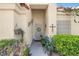 Inviting front entrance with a decorative security door, mature landscaping and a well-maintained walkway at 8217 Ashkum Ave, Las Vegas, NV 89149