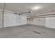 Attached two-car garage with an automatic door, ample space and shelving at 8217 Ashkum Ave, Las Vegas, NV 89149