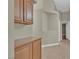 Hallway with a built-in storage and cabinet area and tile flooring at 8217 Ashkum Ave, Las Vegas, NV 89149