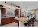 Bright eat-in kitchen features granite counters, stainless appliances, and wood cabinets at 8217 Ashkum Ave, Las Vegas, NV 89149