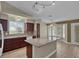 Modern kitchen with granite countertops, an island, and easy access to the outdoor area through sliding glass doors at 8217 Ashkum Ave, Las Vegas, NV 89149
