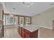 Open kitchen with a granite island, tile floor, recessed lighting, and windows for lots of natural light at 8217 Ashkum Ave, Las Vegas, NV 89149