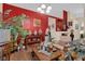 Eclectic living room with eye-catching accent wall, wood floors, and artful decor at 8217 Ashkum Ave, Las Vegas, NV 89149
