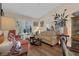 Cozy living room with wood floors, plantation shutters, and comfortable seating at 8217 Ashkum Ave, Las Vegas, NV 89149