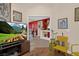 Open living space with tile floors, neutral walls, and decorative wall art at 8217 Ashkum Ave, Las Vegas, NV 89149