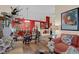 Inviting living room with wood flooring, bright accent wall, and cozy seating at 8217 Ashkum Ave, Las Vegas, NV 89149