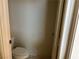 Tight shot of a toilet in a small, simple, and somewhat dingy bathroom at 8419 W Rochelle Ave, Las Vegas, NV 89147