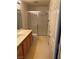 Bathroom with a double vanity, shower with sliding glass door, and toilet at 8419 W Rochelle Ave, Las Vegas, NV 89147