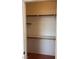 Empty closet features shelves, and a wooden pole for hanging clothes at 8419 W Rochelle Ave, Las Vegas, NV 89147