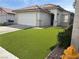 Charming single-story home featuring a well-manicured lawn, and a convenient two-car garage at 8419 W Rochelle Ave, Las Vegas, NV 89147