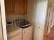 Laundry room with washer, dryer, and storage cabinets at 8419 W Rochelle Ave, Las Vegas, NV 89147