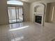 Bright living room featuring a fireplace and sliding glass doors to a sunroom at 8419 W Rochelle Ave, Las Vegas, NV 89147
