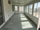 Bright sunroom featuring multiple windows and a door, creating a seamless transition to the outdoors at 8419 W Rochelle Ave, Las Vegas, NV 89147