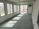 Well-lit sunroom with large windows providing backyard views, perfect for relaxation and entertaining at 8419 W Rochelle Ave, Las Vegas, NV 89147