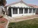 Enclosed patio with ample natural light from the screened windows, offering a versatile outdoor space at 8419 W Rochelle Ave, Las Vegas, NV 89147