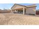 Expansive backyard featuring a covered patio, offering great outdoor living potential at 8575 Nicholas James Ave, Las Vegas, NV 89143