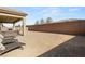 Expansive backyard featuring a covered patio and potential for landscaping and outdoor living at 8575 Nicholas James Ave, Las Vegas, NV 89143