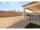 The property has a backyard with a covered patio, perfect for outdoor entertaining at 8575 Nicholas James Ave, Las Vegas, NV 89143