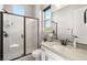 Bright bathroom featuring a glass shower, toilet, single vanity and modern fixtures for a relaxing experience at 8575 Nicholas James Ave, Las Vegas, NV 89143