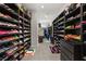 Massive walk-in closet with organized shoe racks and hanging space offering ample storage solutions at 8575 Nicholas James Ave, Las Vegas, NV 89143