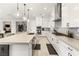 Well-lit kitchen featuring an expansive island, stainless steel appliances, and ample counter space for cooking and entertaining at 8575 Nicholas James Ave, Las Vegas, NV 89143