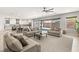 Open floor plan features spacious living room, dining area, gourmet kitchen, and backyard access at 8575 Nicholas James Ave, Las Vegas, NV 89143
