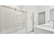 Bathroom with sleek glass shower doors and linen cabinet at 8591 Cloudy Dawn Way, Las Vegas, NV 89113