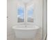 Close-up of a modern bathtub in a bright bathroom at 8591 Cloudy Dawn Way, Las Vegas, NV 89113