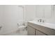 Modern bathroom with gray vanity, white countertop, toilet, and tiled floors at 8591 Cloudy Dawn Way, Las Vegas, NV 89113