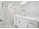 Modern bathroom featuring a walk-in shower, marble countertops, and new white cabinets at 8591 Cloudy Dawn Way, Las Vegas, NV 89113