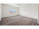 Light-filled bedroom with plush carpet and plantation shutters at 8591 Cloudy Dawn Way, Las Vegas, NV 89113