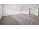 Bright bedroom with plush carpeting, recessed lighting, and a view of the entryway at 8591 Cloudy Dawn Way, Las Vegas, NV 89113
