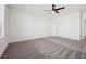 Spacious bedroom features modern ceiling fan, plush carpet, and white trim at 8591 Cloudy Dawn Way, Las Vegas, NV 89113