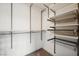 Custom closet features adjustable shelving and metal accents at 8591 Cloudy Dawn Way, Las Vegas, NV 89113
