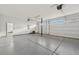 A large three car garage with epoxy floors and room for plenty of storage at 8591 Cloudy Dawn Way, Las Vegas, NV 89113