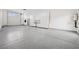 A large three car garage with epoxy floors and built-in cabinets at 8591 Cloudy Dawn Way, Las Vegas, NV 89113