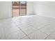 Bright room featuring tile flooring and sliding glass doors to backyard at 8591 Cloudy Dawn Way, Las Vegas, NV 89113