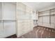 Spacious walk-in closet featuring custom shelving, drawers and ample hanging space at 8591 Cloudy Dawn Way, Las Vegas, NV 89113